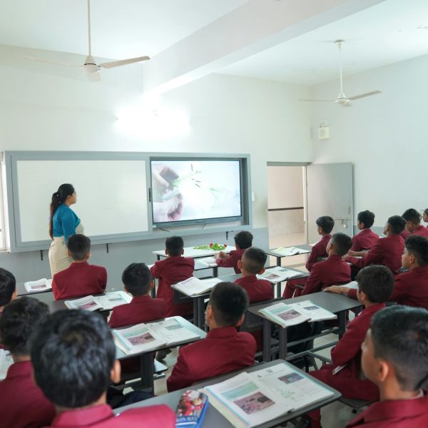 pexels-photo-35551059-35551059 Students attentively learning in a modern classroom with an interactive display at Petlad, Gujarat.